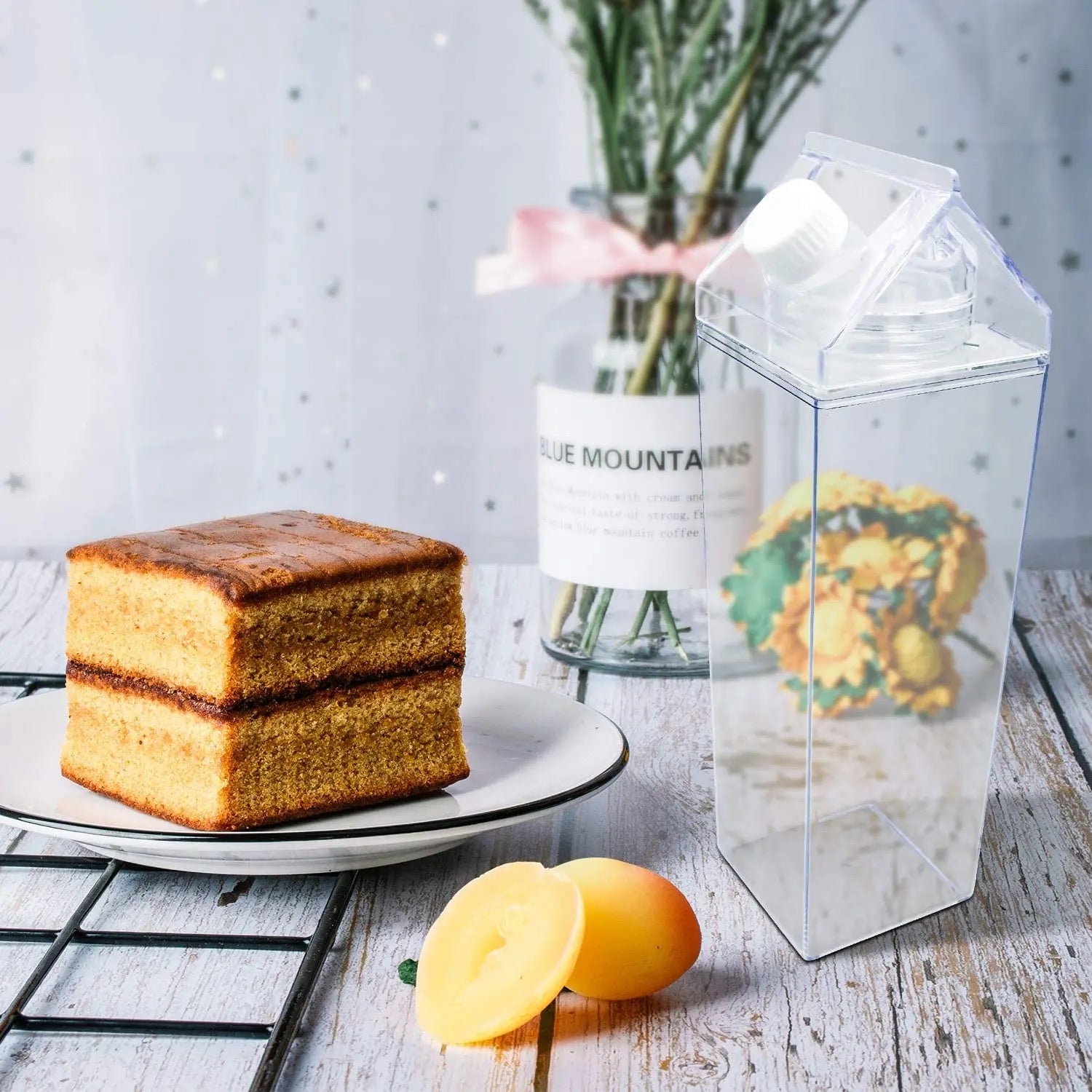 A Transparent Plastic Juice Bottle is Placed Near Cake.