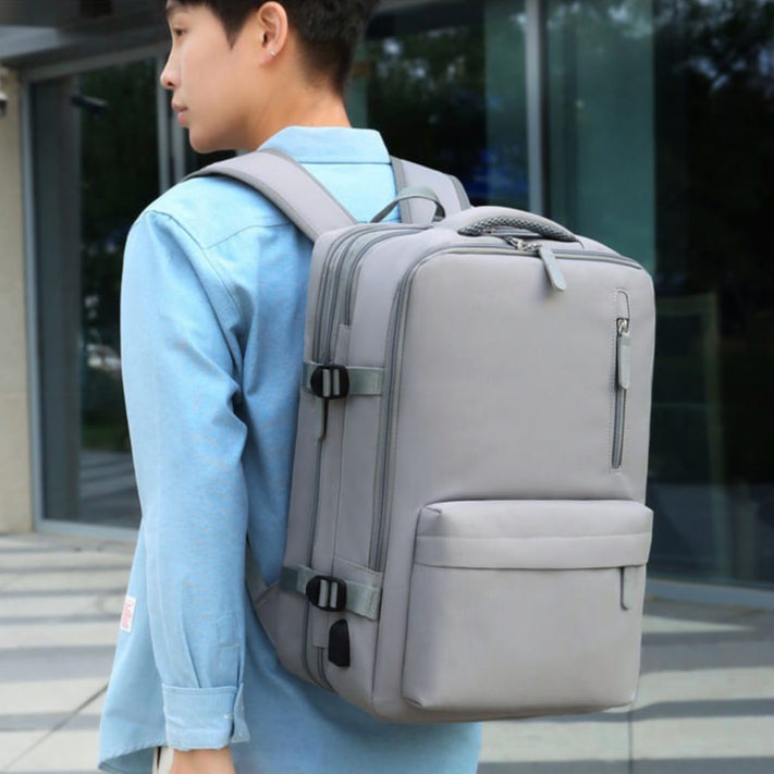 A Person is Carrying Travel Bacpack.