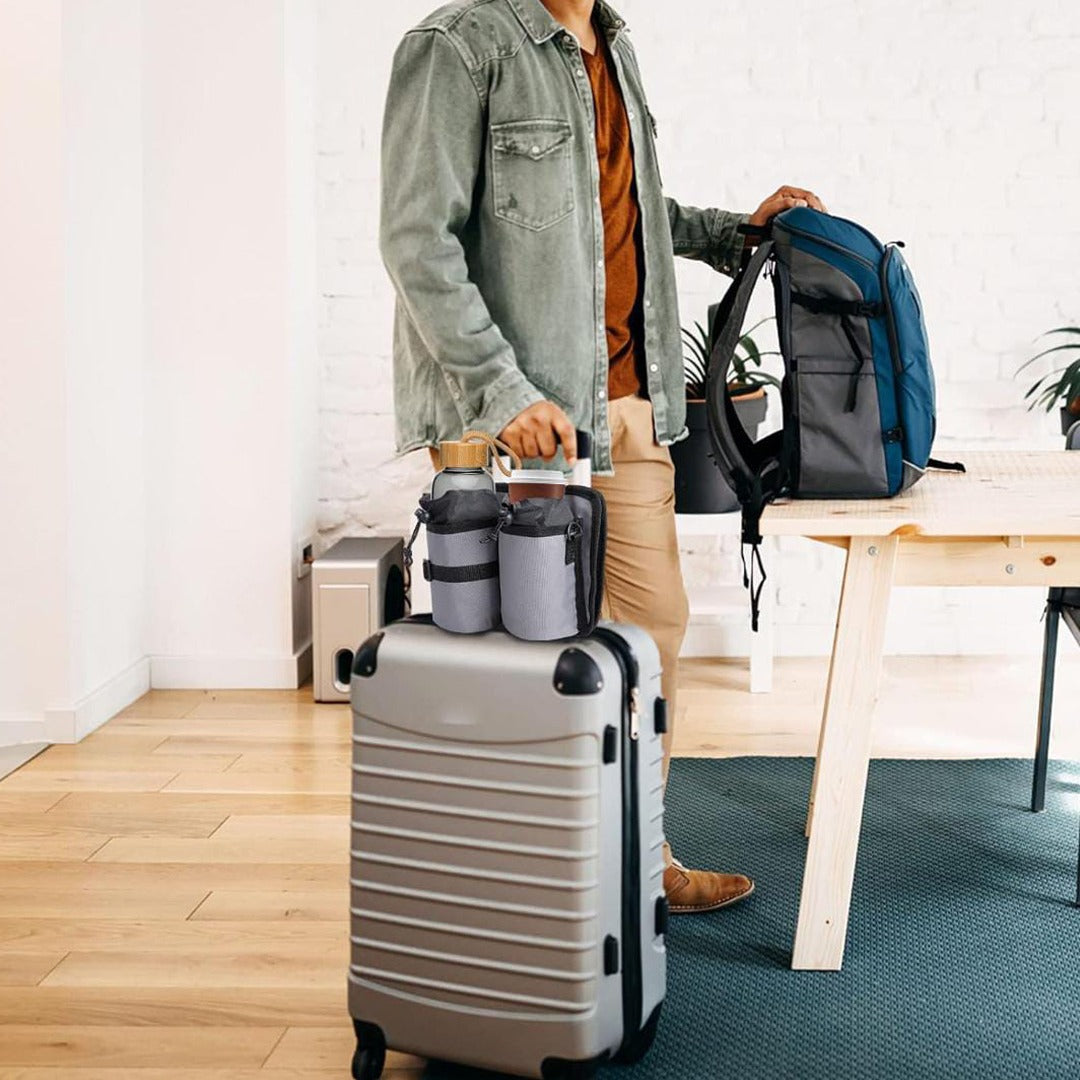 A Man is Holding Travel Drink Holder Bag Attached to a Trolley Bag.