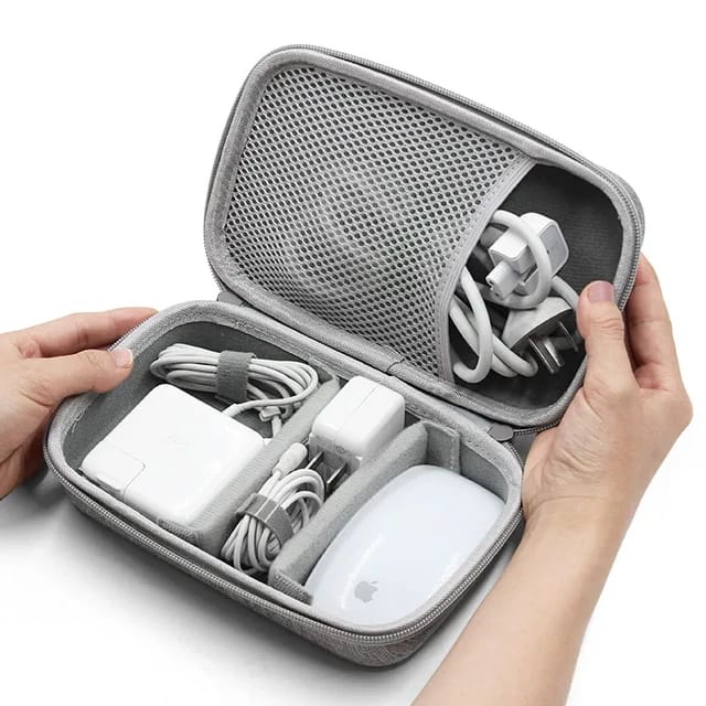 A Person is Organizing Travel Electronic Gadget Storage Bag With Chargers and Cables.