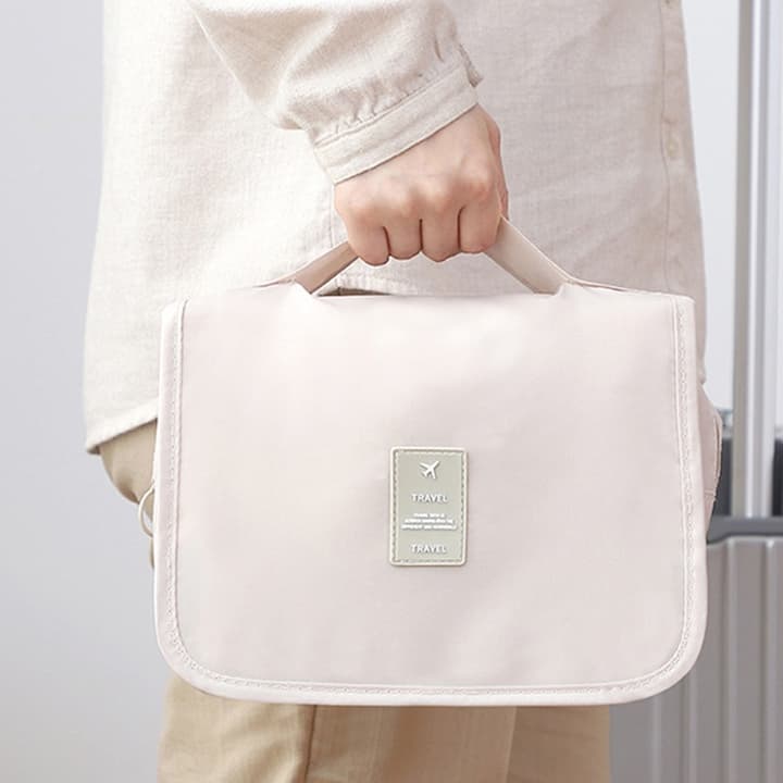 A Person is Holding Travel Toiletry Storage Bag.