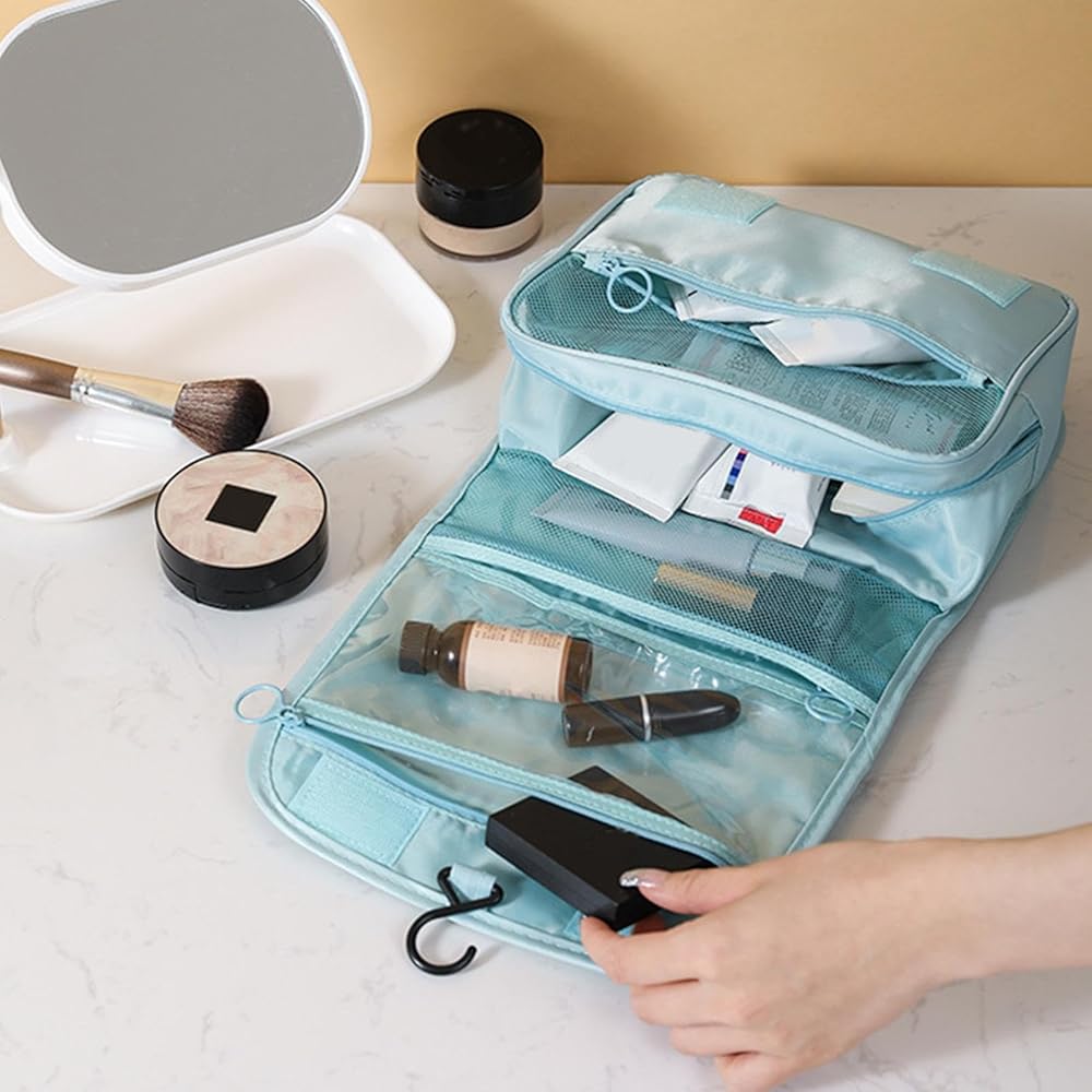 A Person is Keeping Makeup items to Travel Toiletry Storage Bag.