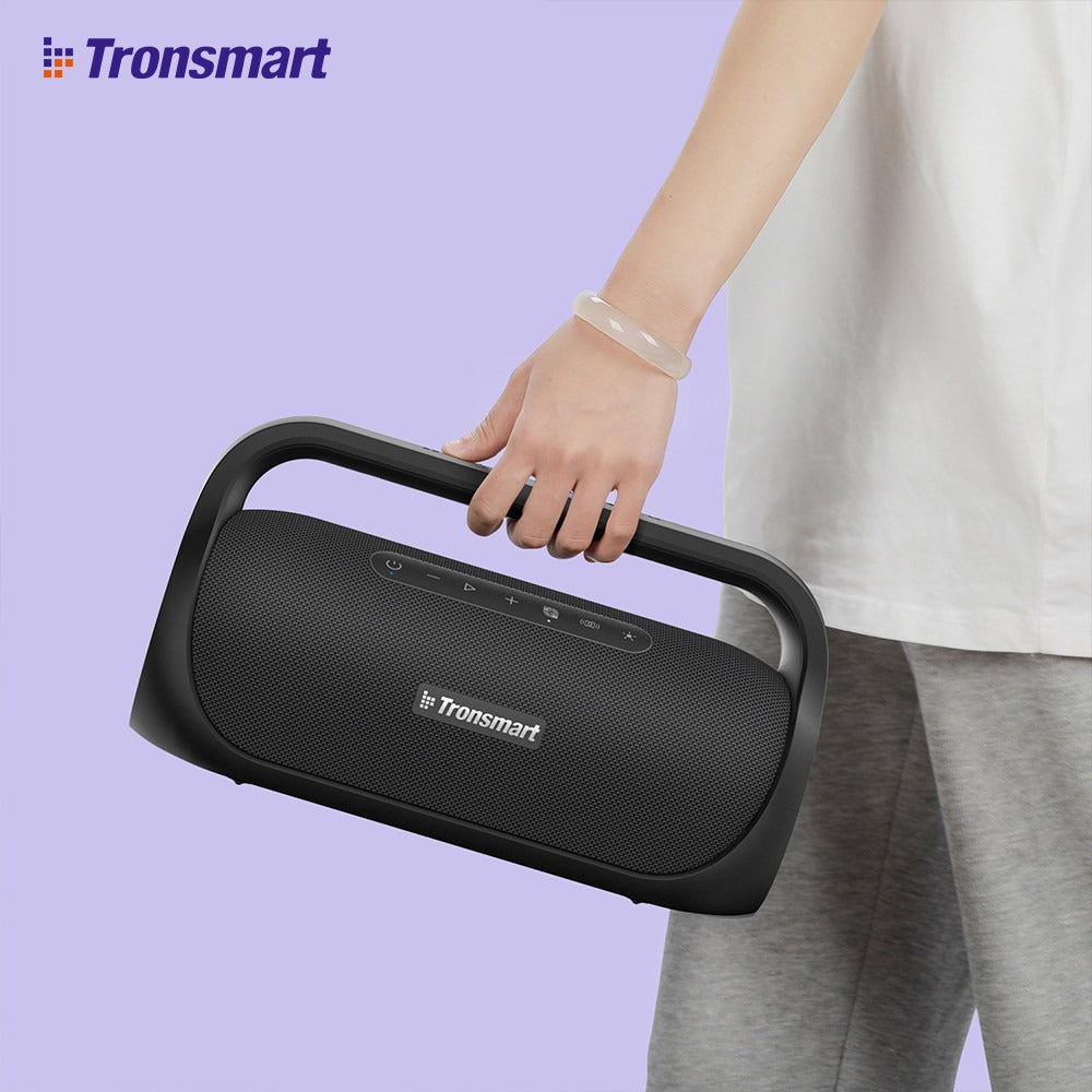 A Person is Carrying Tronsmart Bang Mini Portable Party Speaker.