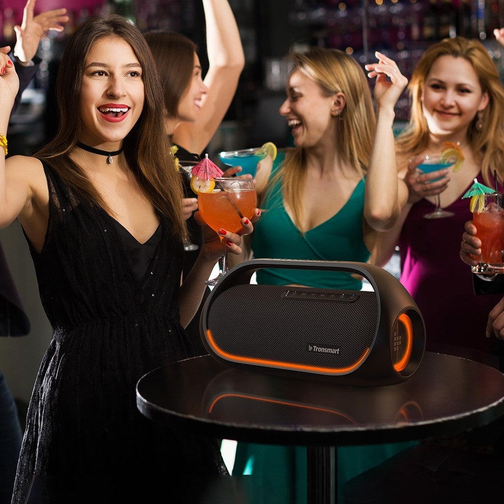 A Group Of People Partying With Tronsmart Bang Portable Party Speaker.