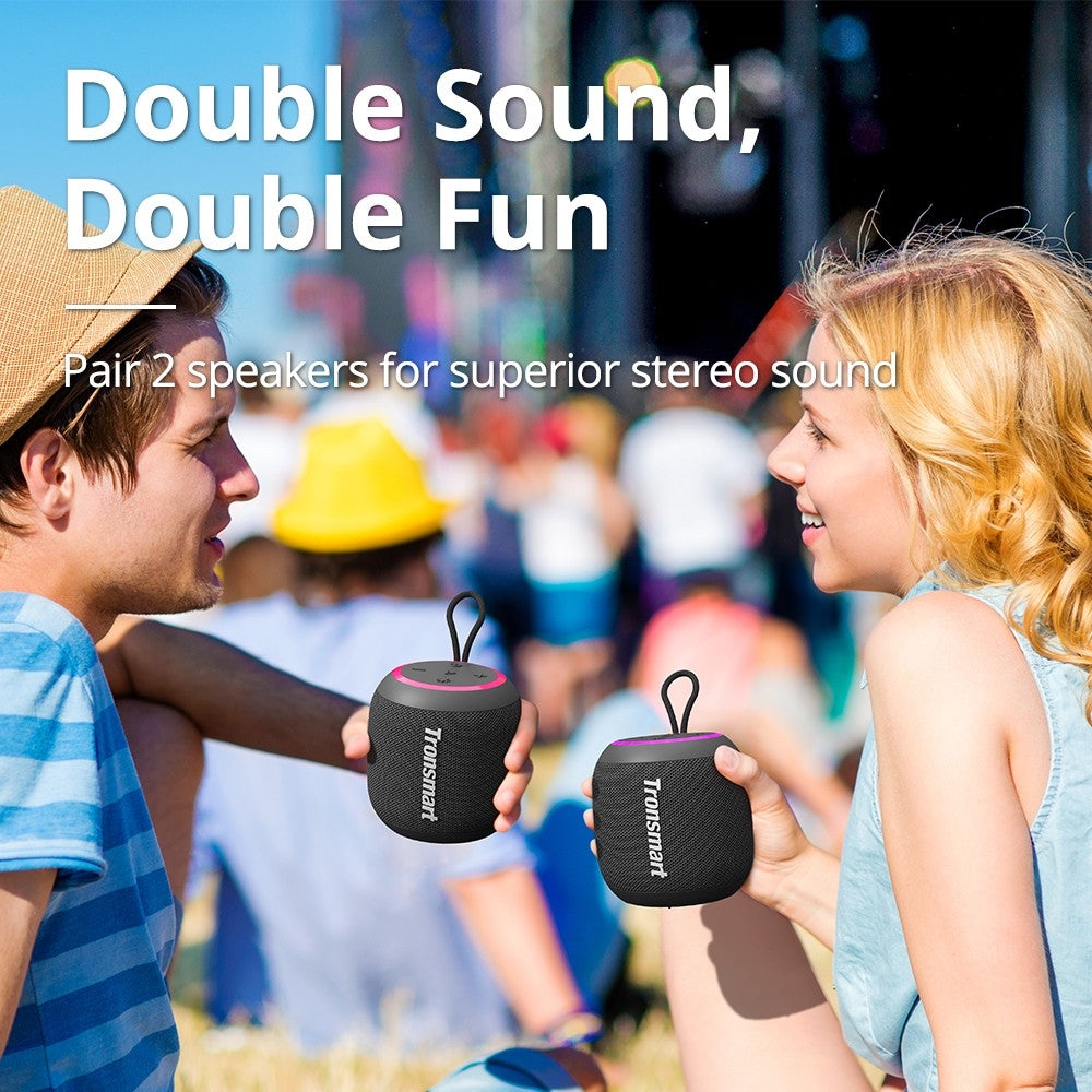 A Couple is Enjoying By Playing Tronsmart T7 Mini Outdoor Speaker.