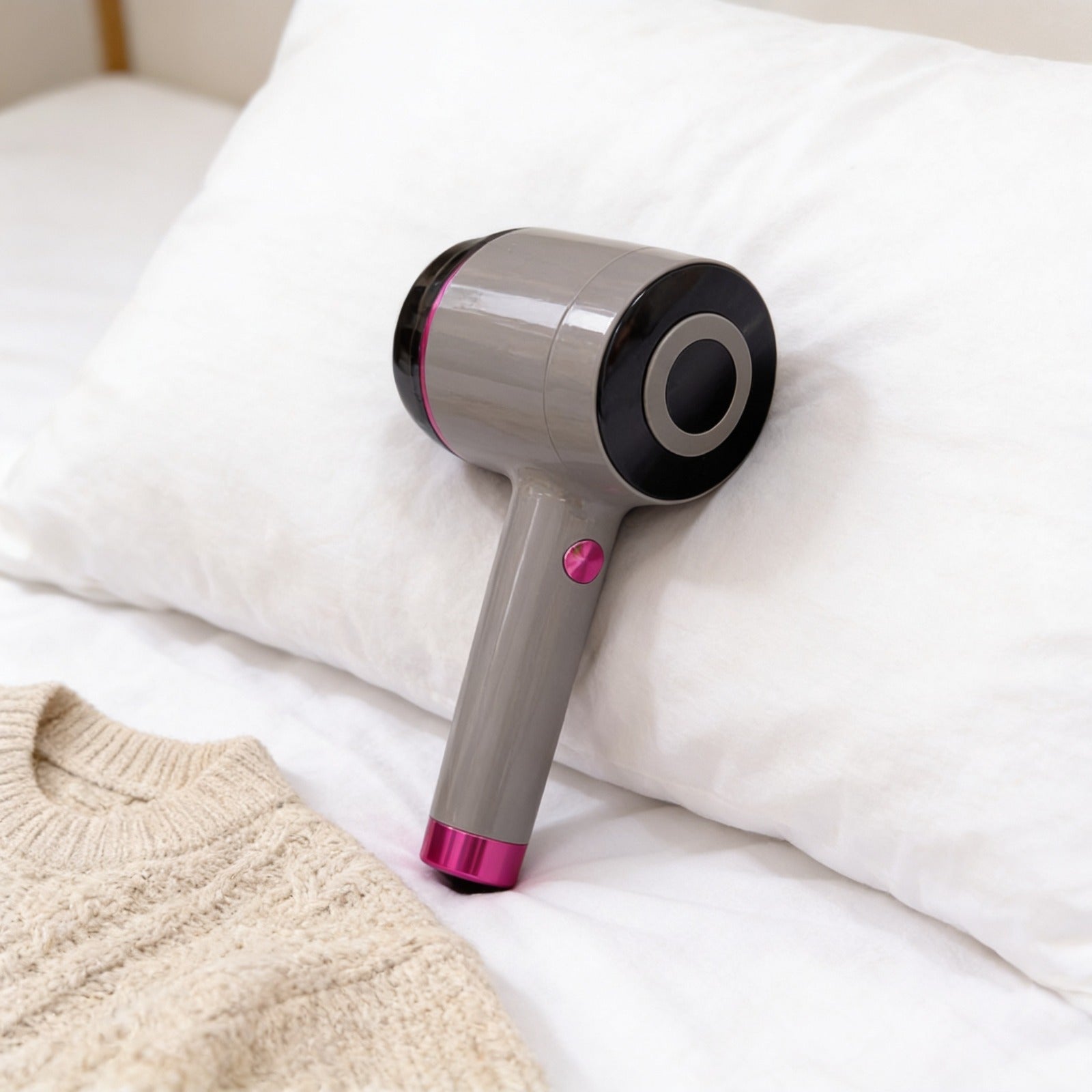 USB Rechargeable Fabric Lint Remover Placed in a Bed.