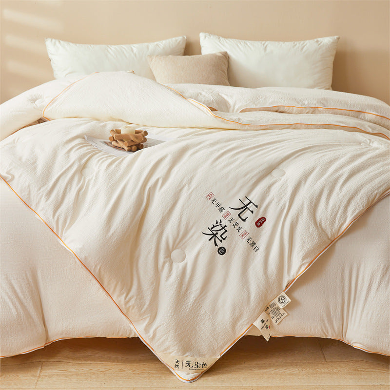 A Ultra Soft Soy Fiber Comforter is Arranged on a Bed.