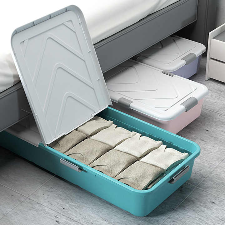 Underbed Storage Box Containers are Placed Under Bed With Cloths are Organized in it.