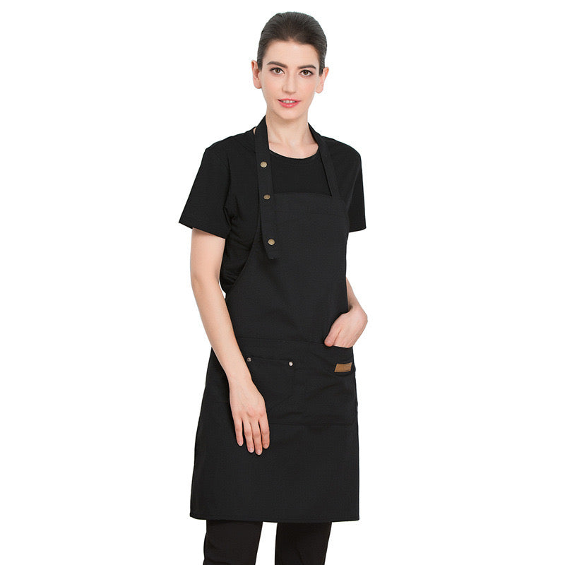 A Women is Wearing  Unisex Adjustable Kitchen Chef Apron.
