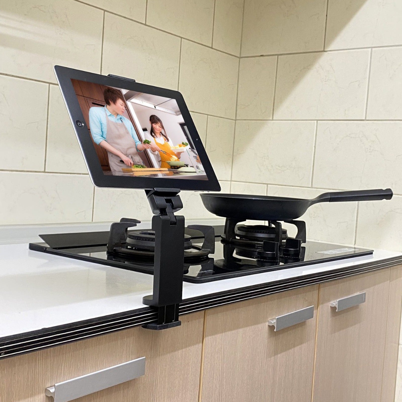 A Tablet is Placed On Kitchen Countertop Using Universal Mobile Phone Mount Holder.