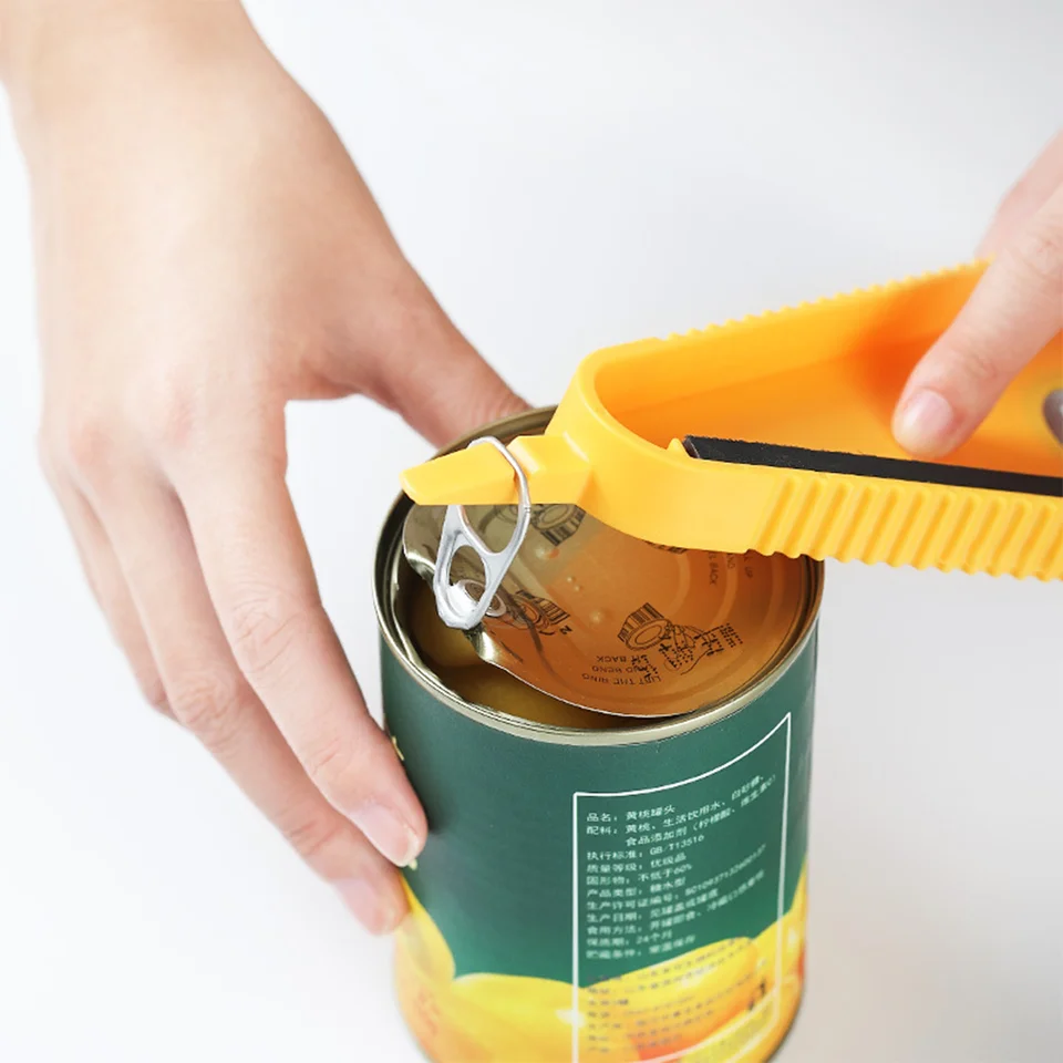 A Person is Opening The Lid Of a Bottle Using Bottle Can Opener.