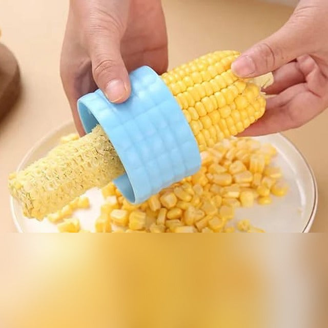 A Person is Peeling Corn Using Corn Stripper Peeler.