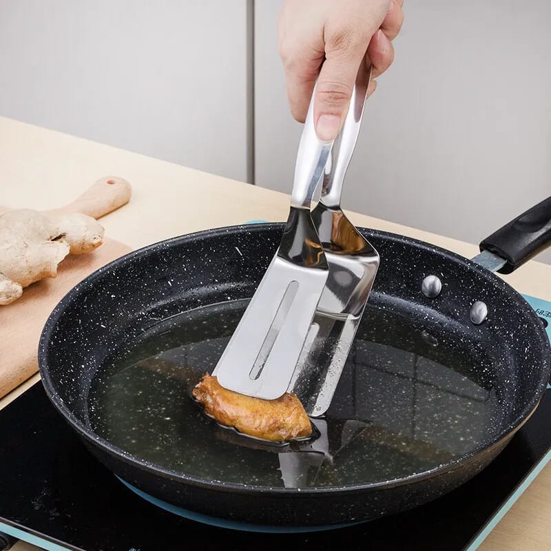 Someone cooking with the help of Stainless Steel Food Tongs