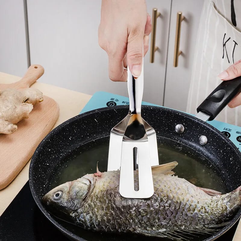 Someone cooking fish with the help of Stainless Steel Food Tongs