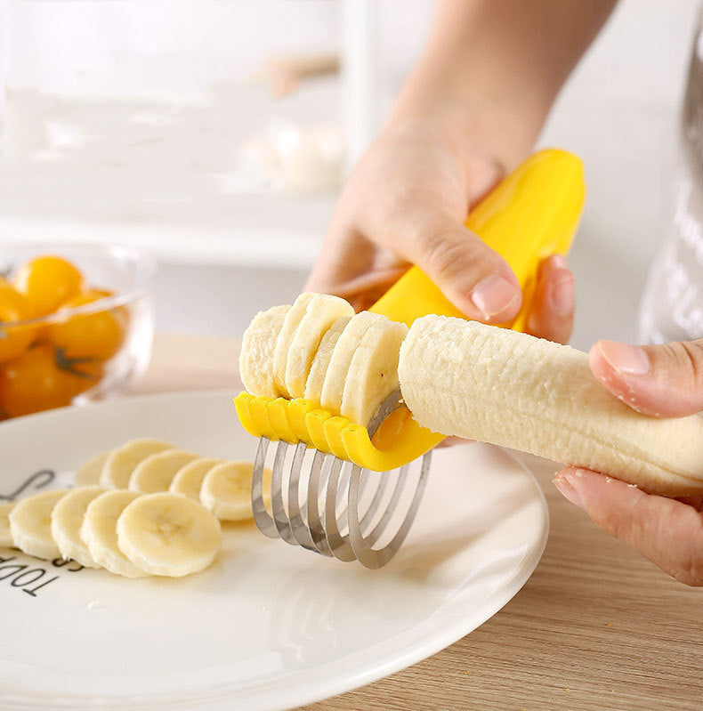 Someone cutting a banana with the help of a Stainless Steel Banana Cutter Slicer