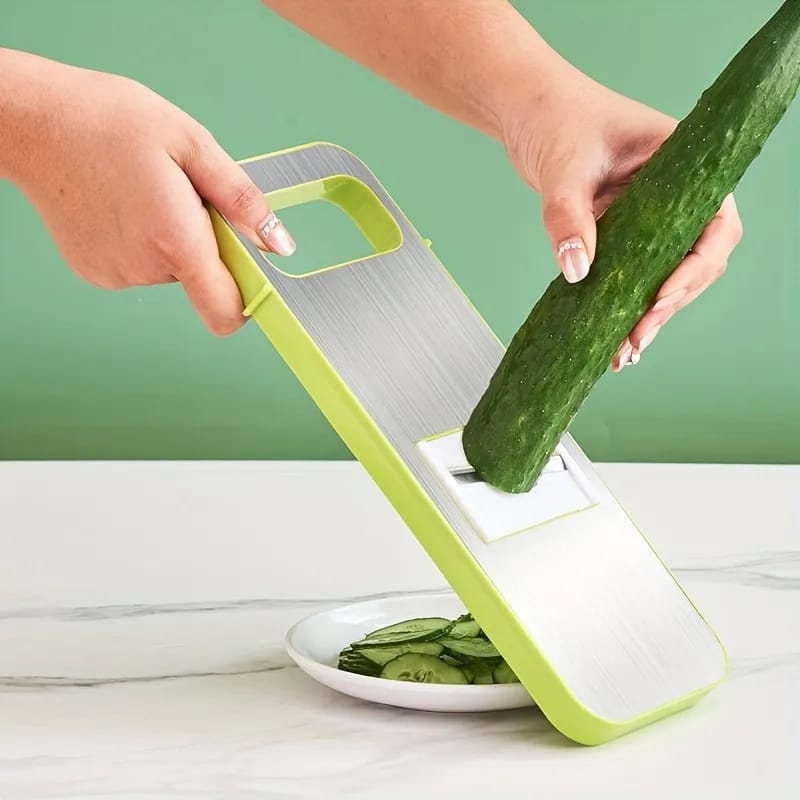 Slicing cucumber with food slicer.