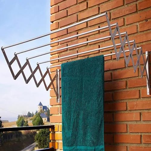 Wall-mounted 5-bar extendable clothes hanger on the wall