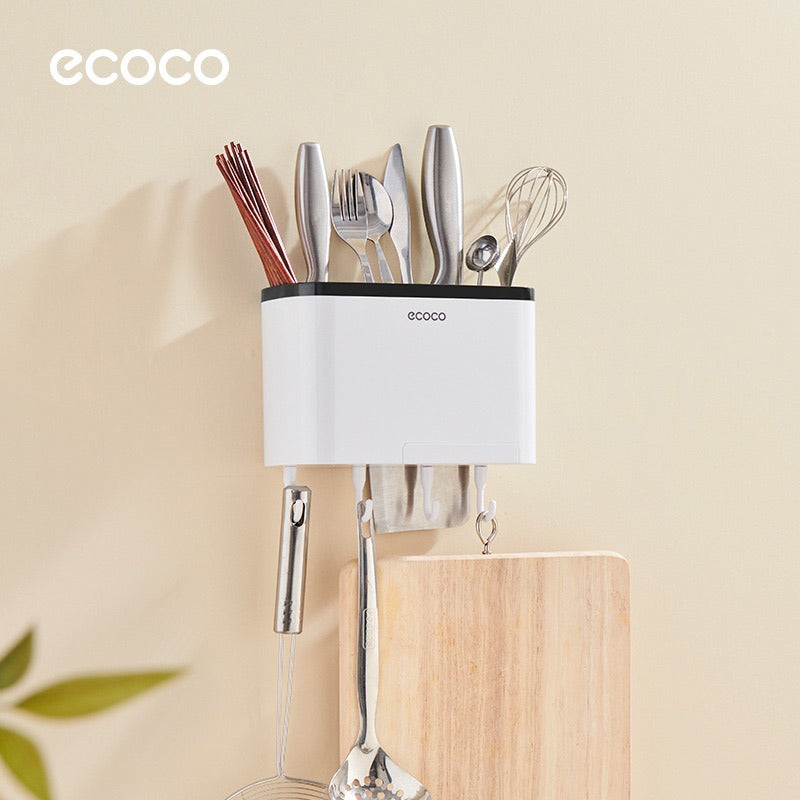 Ecoco Utensil Storage Rack placed on the wall with some items in it