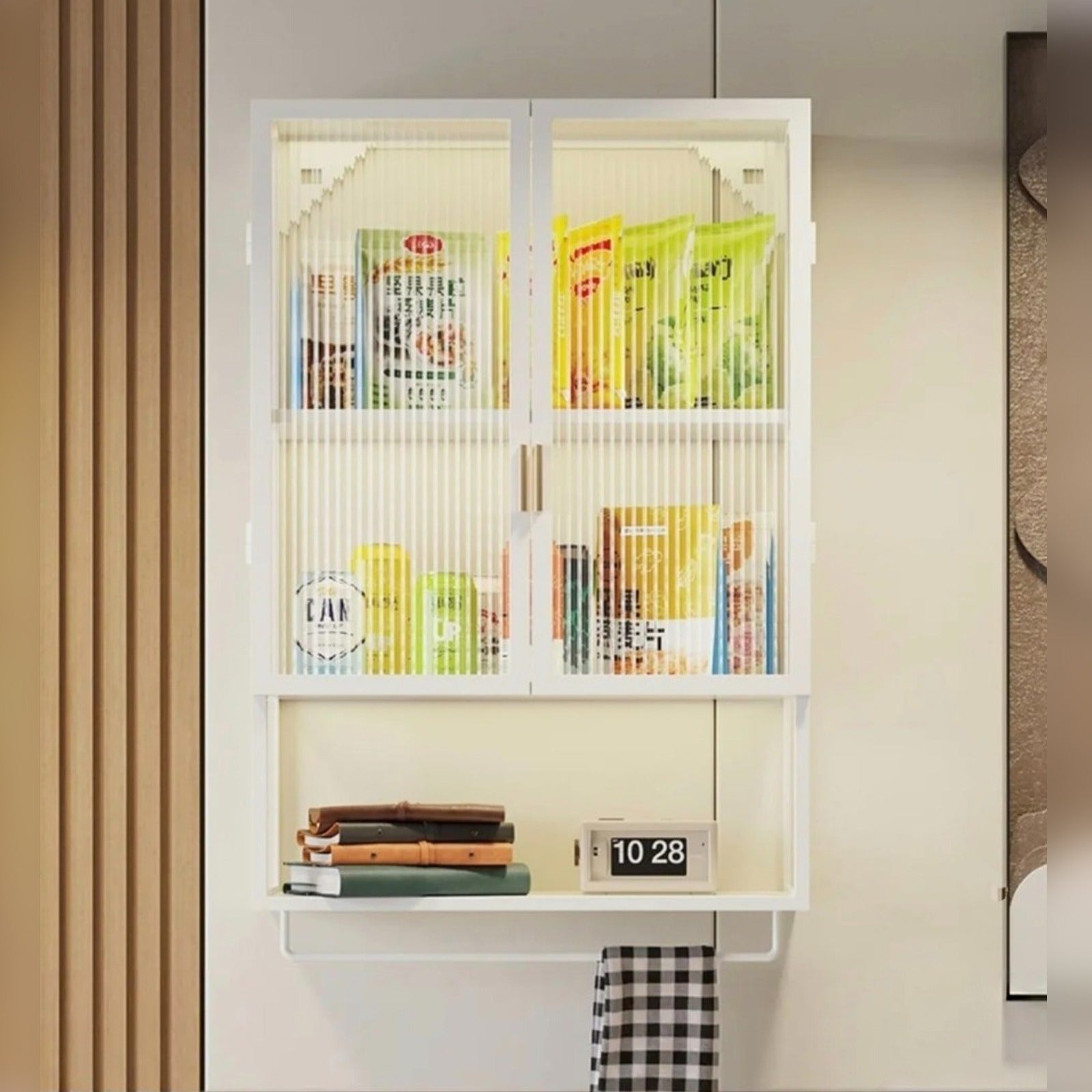 Wall-mounted storage organizer with ribbed glass doors, displaying neatly arranged home essentials.