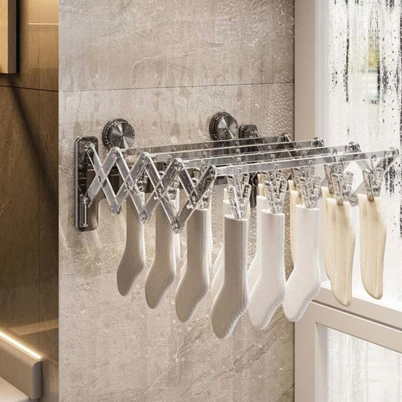 Socks are Hanged on the Wall Mounted Foldable Suction Cup Sock Cloth Drying Hanger Rack.