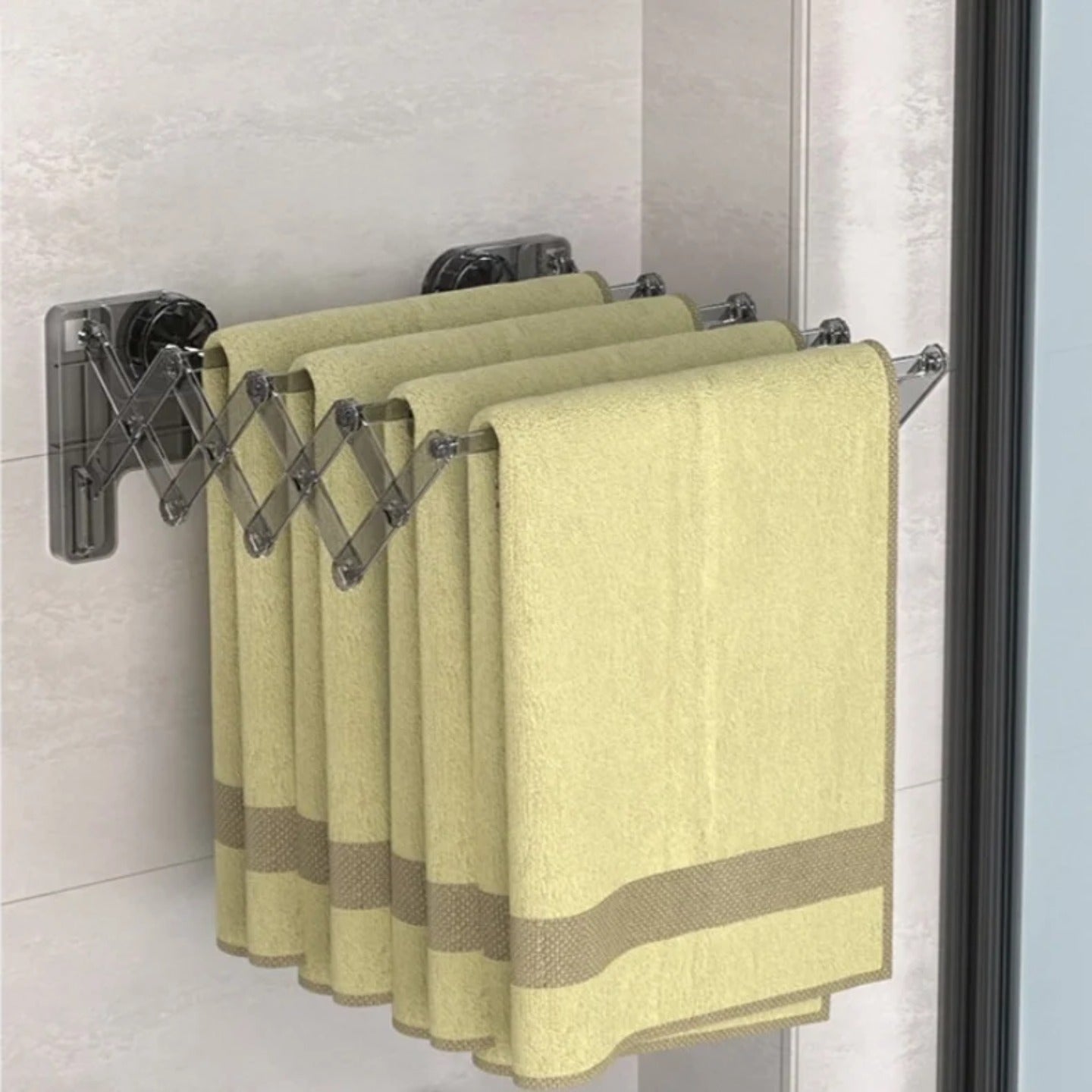 Towels are Hanged on Wall Mounted Foldable Suction Cup Sock Cloth Drying Hanger Rack.