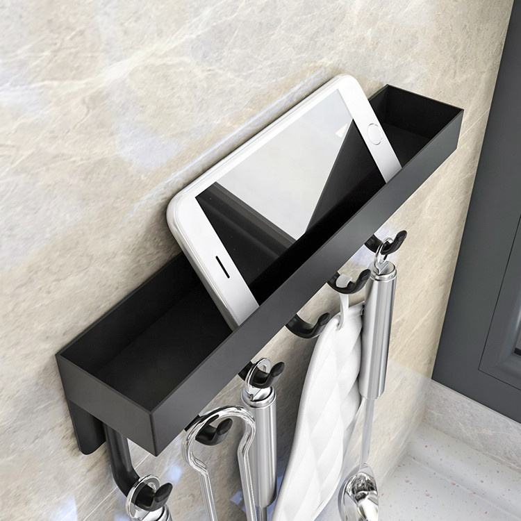A Wall Mounted Key Holder with Storage Organizer is Organized with Various Essentials.