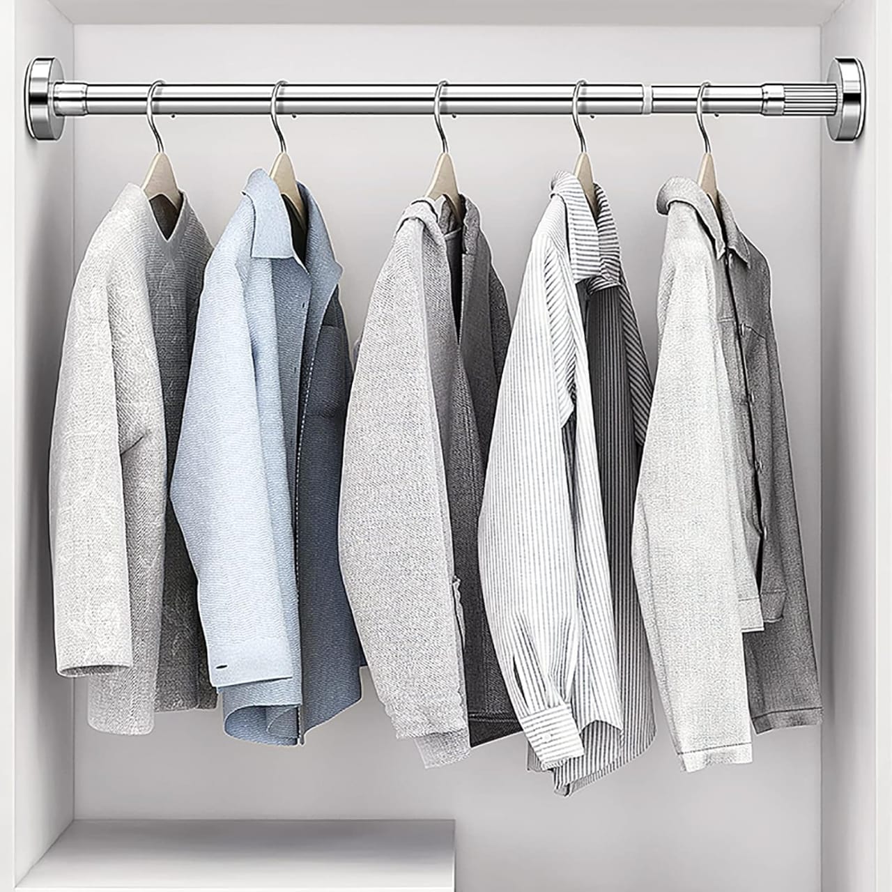 Clothes Are Hanged On the Wall Mounted Retractable Cloth Hanger Stand.