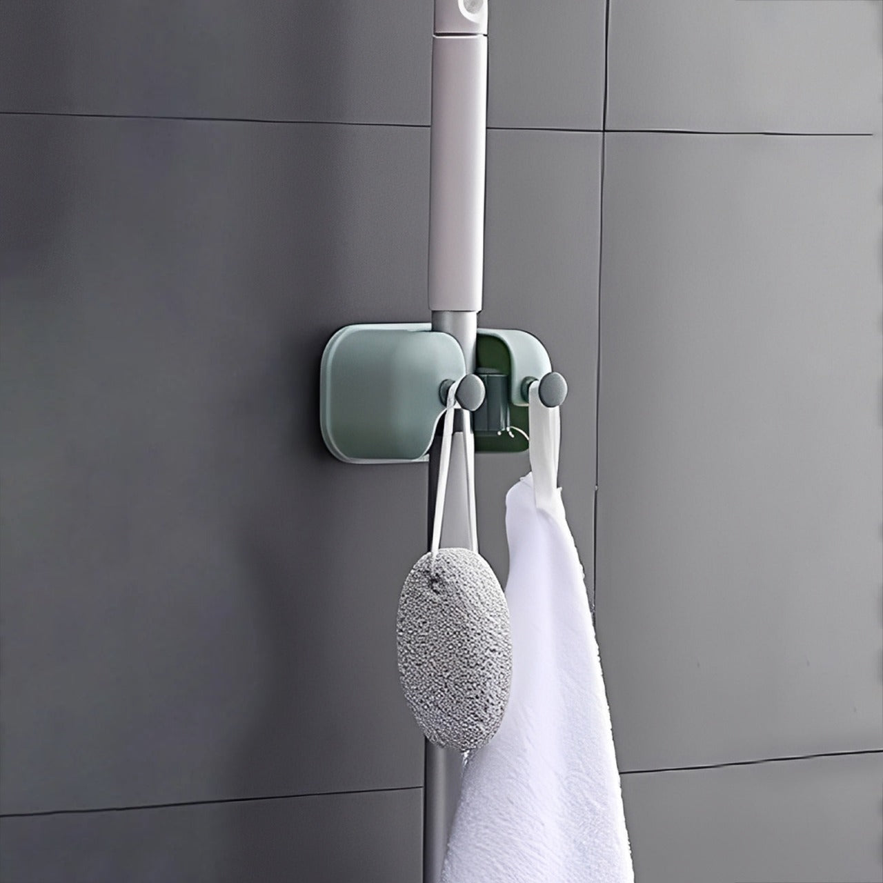Mop and Other Cleaning Accessories are Organized at Wall Mounted Single Mop Holder.
