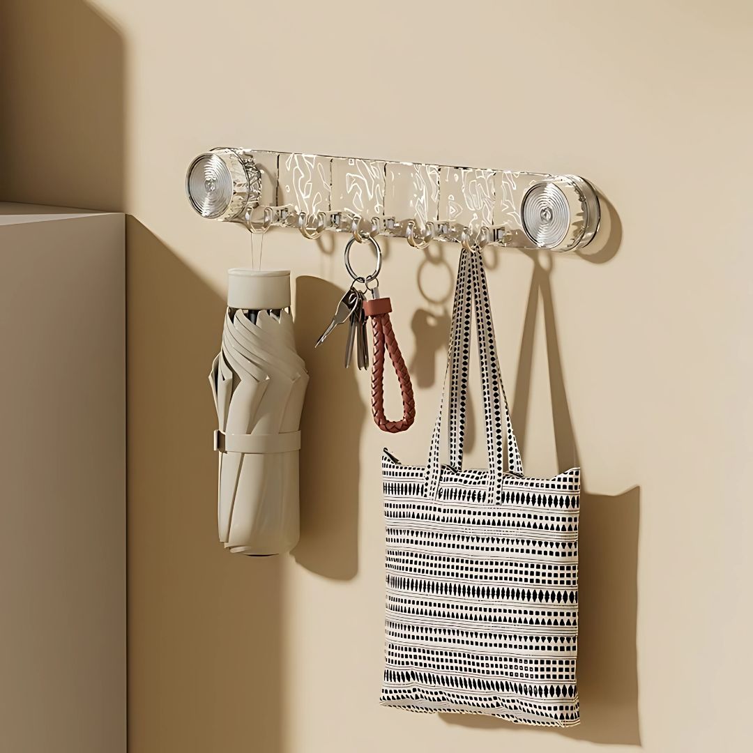 A Wall Mounted Suction Hook Holder is Fixed on a Wall Holding Daily Essentials.