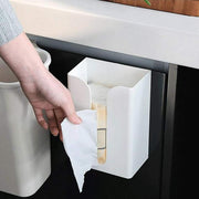A Person is Taking Tissue Kept in a Wall Mounted Tissue Box Holder Dispenser Rack.