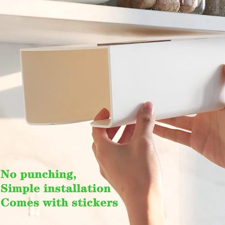 A Person is Fixing Wall Mounted Tissue Box Holder Dispenser Rack On