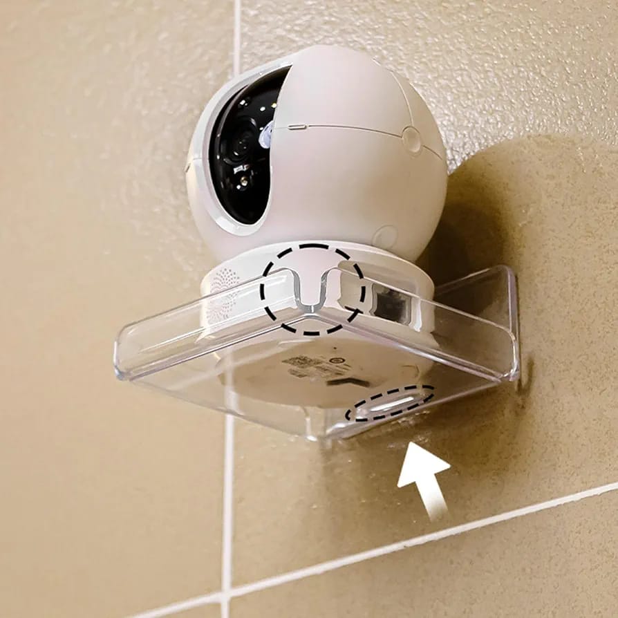 A security camera is placed on a Wall mounted mini storage rack.