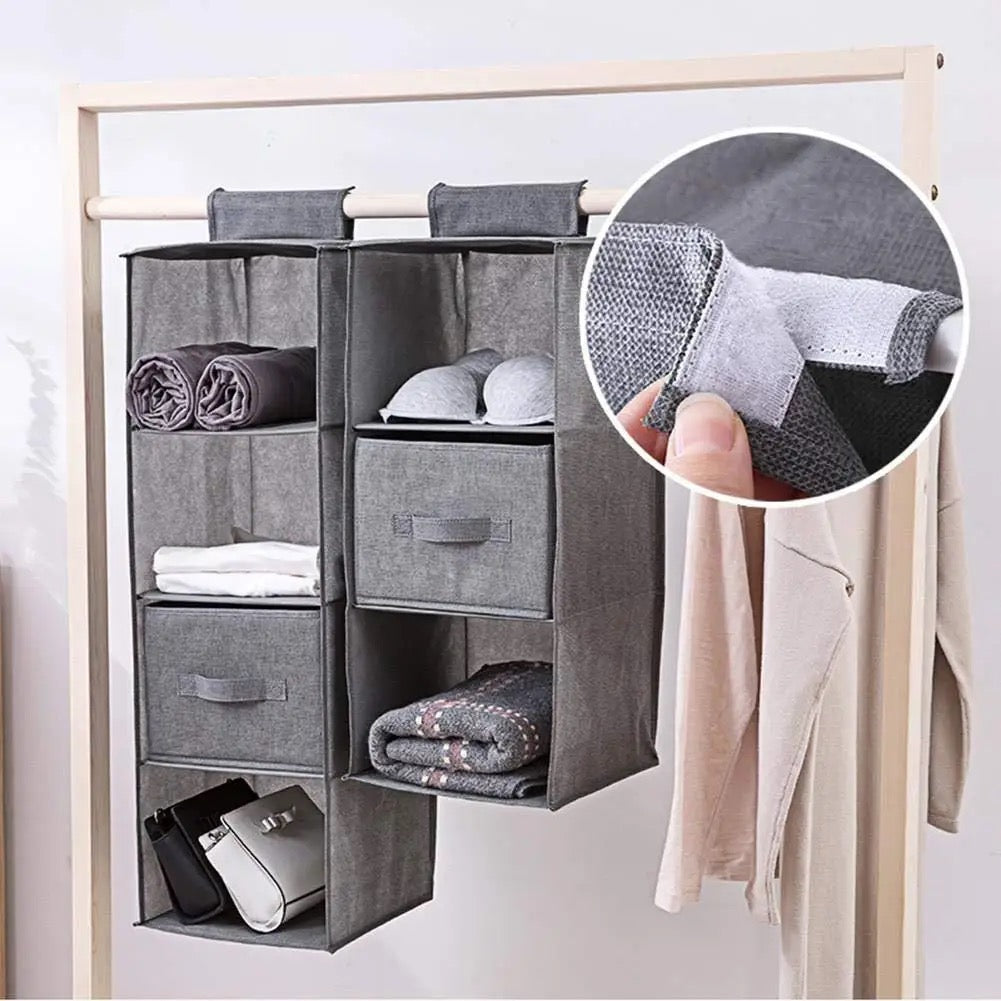 Wardrobe clothes storage bags hanging on the rack
