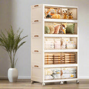 Wardrobe Storage Cabinet Organized with Bedsheets, Toys and Blankets.
