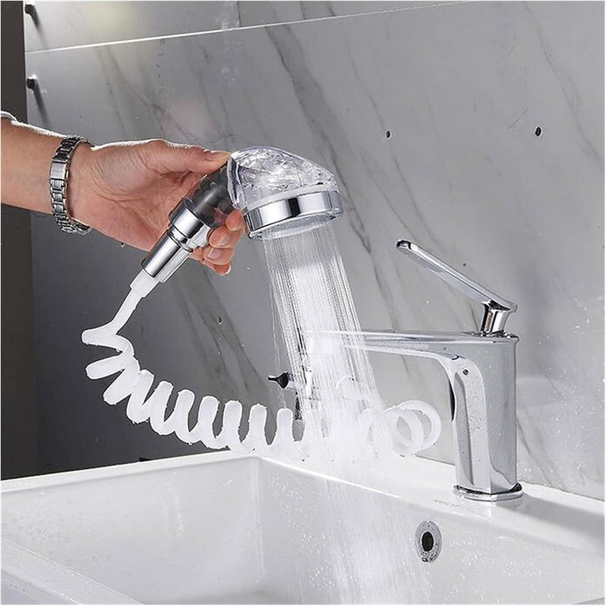Handheld shower head with hose attached to a sink faucet