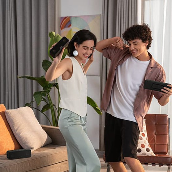 A Couple Enjoys Music With ANKER Soundcore 3 Portable Waterproof Bluetooth Speaker.