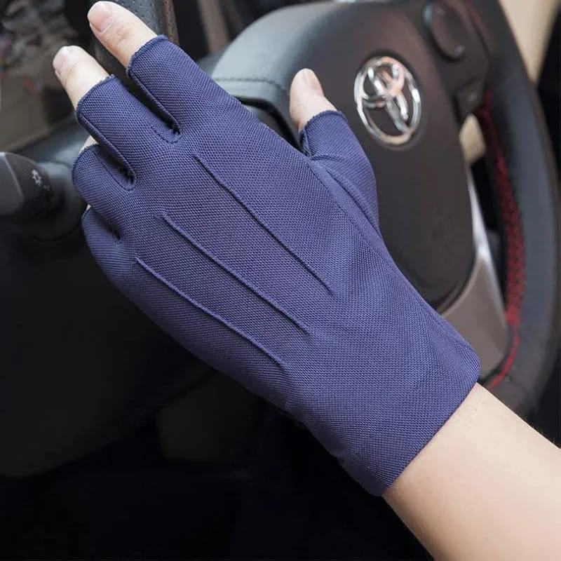 A Person is Wearing Fingerless Gloves While Driving.