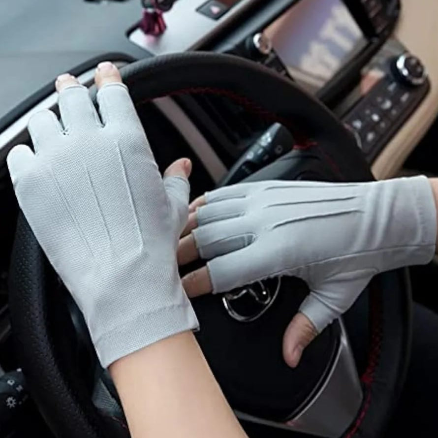 A Person is Wearing Fingerless Gloves While Driving.