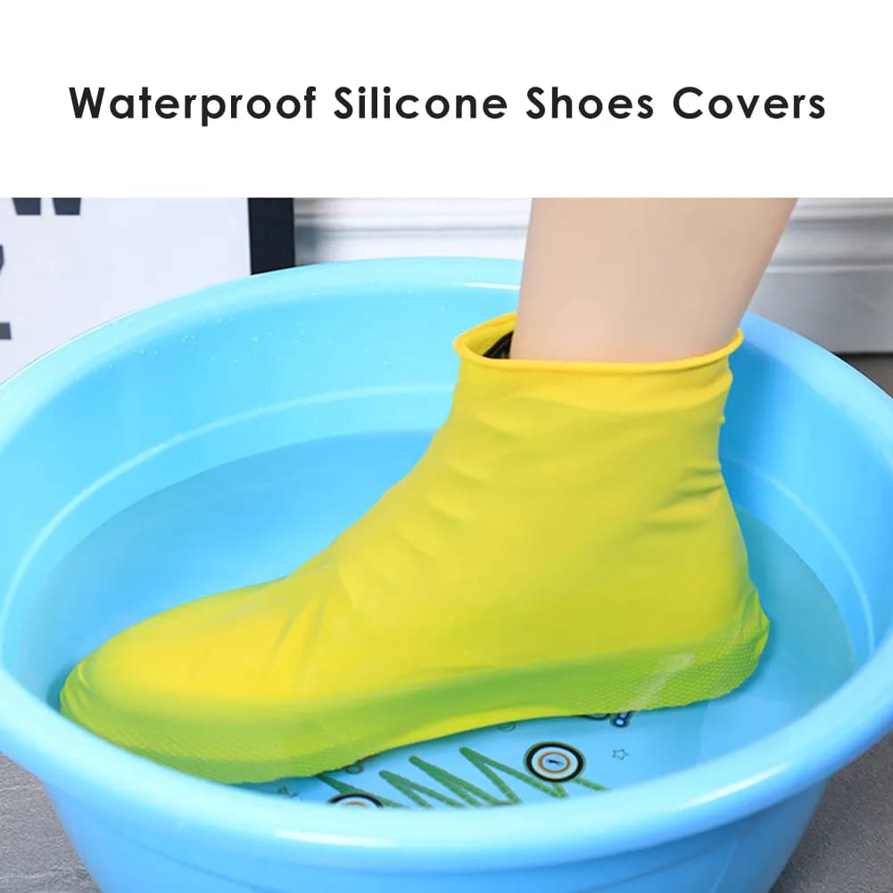 A Person is Protected his Shoe by Wearing Silicone Waterproof Shoe Cover.