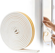 A Person is Sticking Weather Stripping Door Tape.
