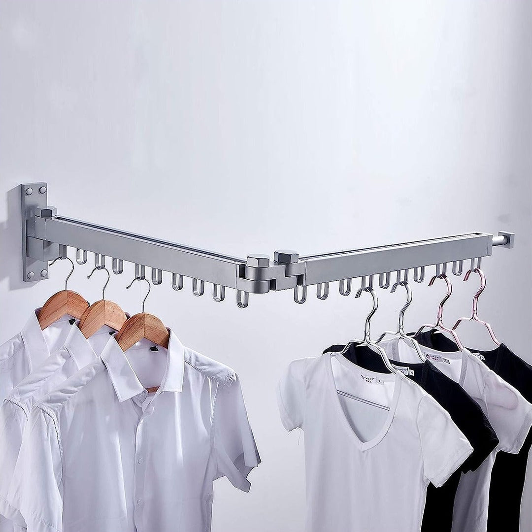 Collapsible Drying Hanger mounted on a wall with cloths hung on it
