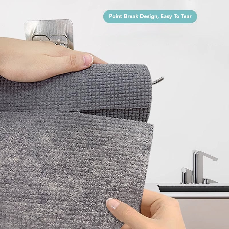 A person extracting 1 Roll/25pcs Disposable Kitchen Cleaning Cloth Roll to show easy accessibility 