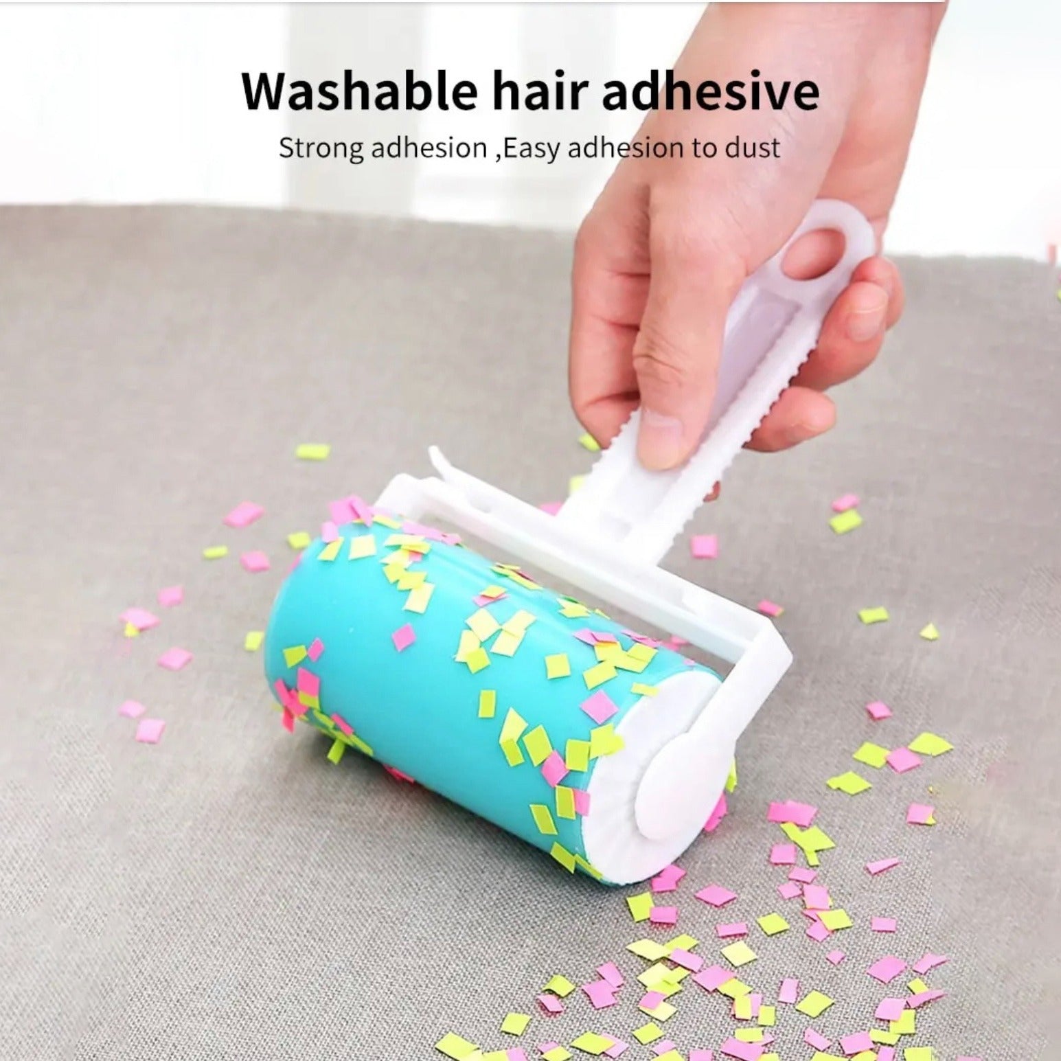 A person rolls confetti on a cloth using a reusable lint remover