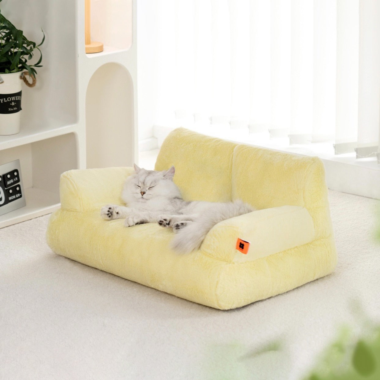 A cat sleeping on a yellow color Cat Sofa Couch Cushion 
