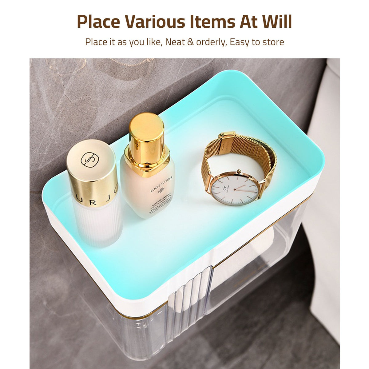 View of a watch and perfume bottles placed on the top of Transparent Wall-Mounted Toilet Paper Holder with Storage Shelf  