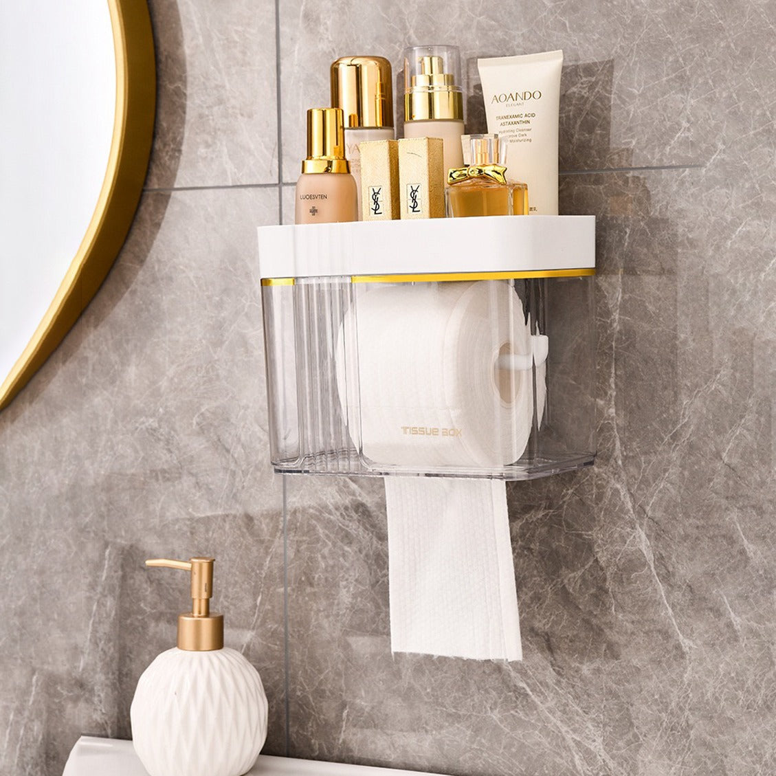 A tissue roll and cosmetic items stored in a Transparent Wall-Mounted Toilet Paper Holder with Storage Shelf next to a handwash liquid 