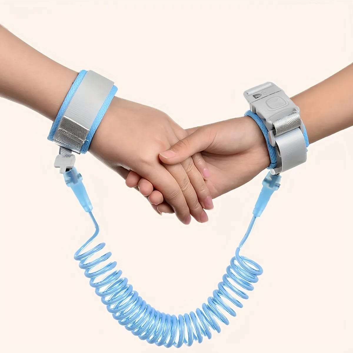Hands tied with Blue Child Safety Harness Leash holding each other