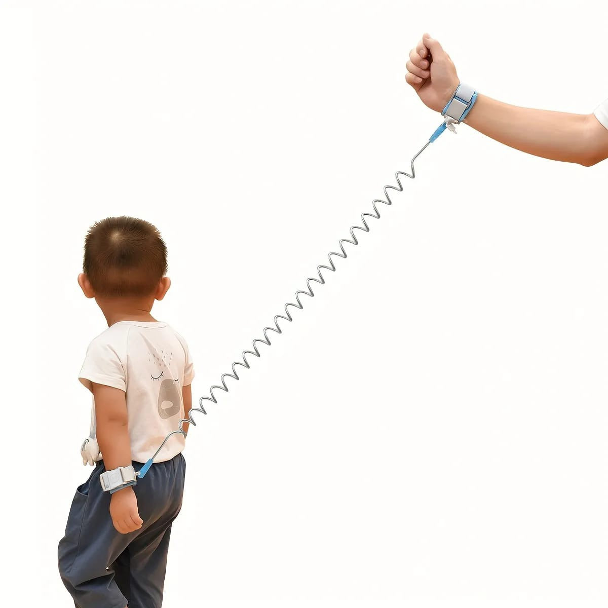 A child walking with his parent along with Child Safety Harness Leash tied on their hands