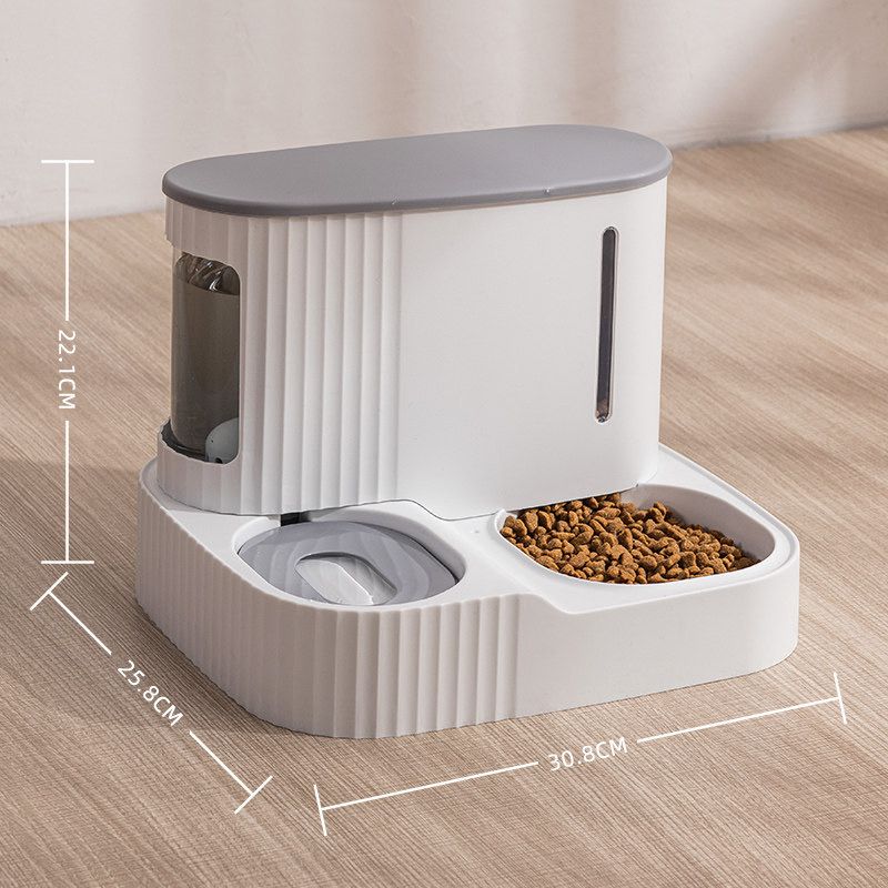 Grey color Automatic Pet Feeder & Water Dispenser placed on a wooden floor by mentioning it's size 