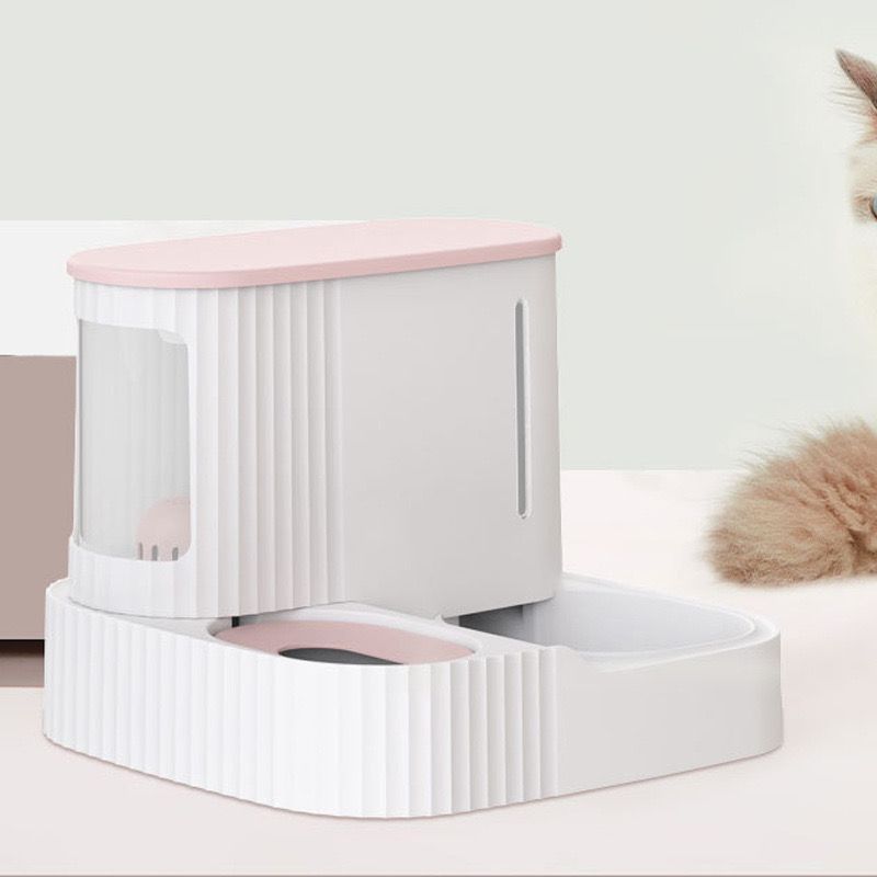Pink color Automatic Pet Feeder & Water Dispenser placed next to a Cat 